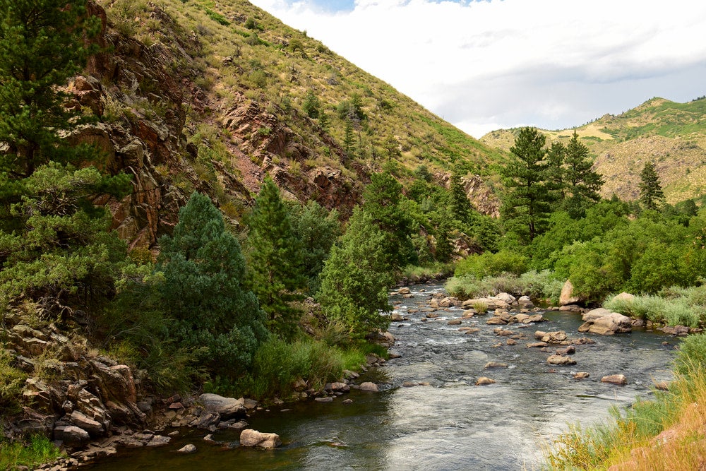 South Platte River rushing past rocky landscape.