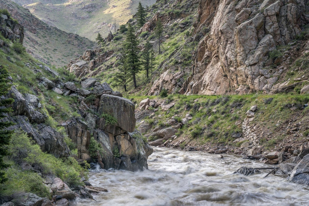 Cache La Poudre River running through mountains.