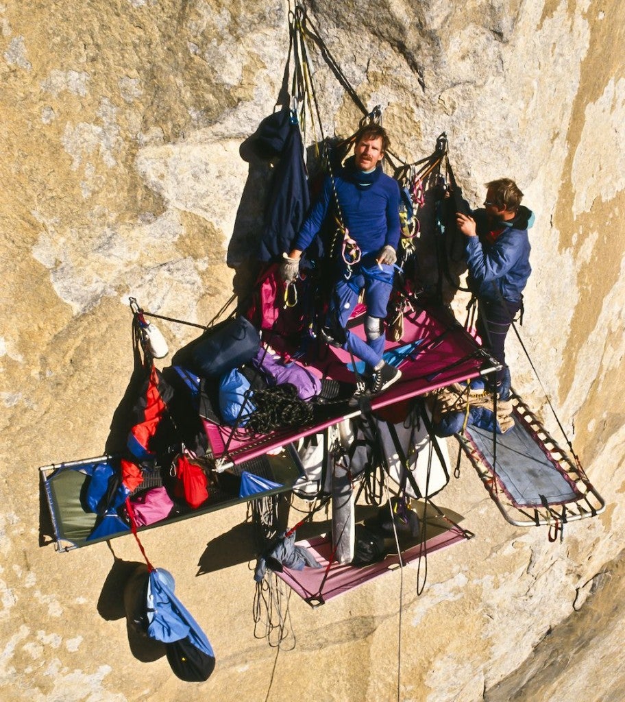 Climbers at their portaledge camp on a large wall.