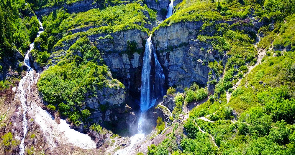 a mossy waterfall on a cliff in utah