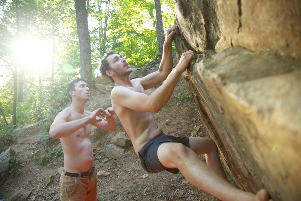 Two men bouldering 