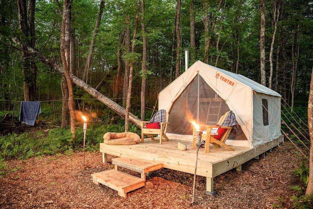 a glamping tent at a campsite in maine at night