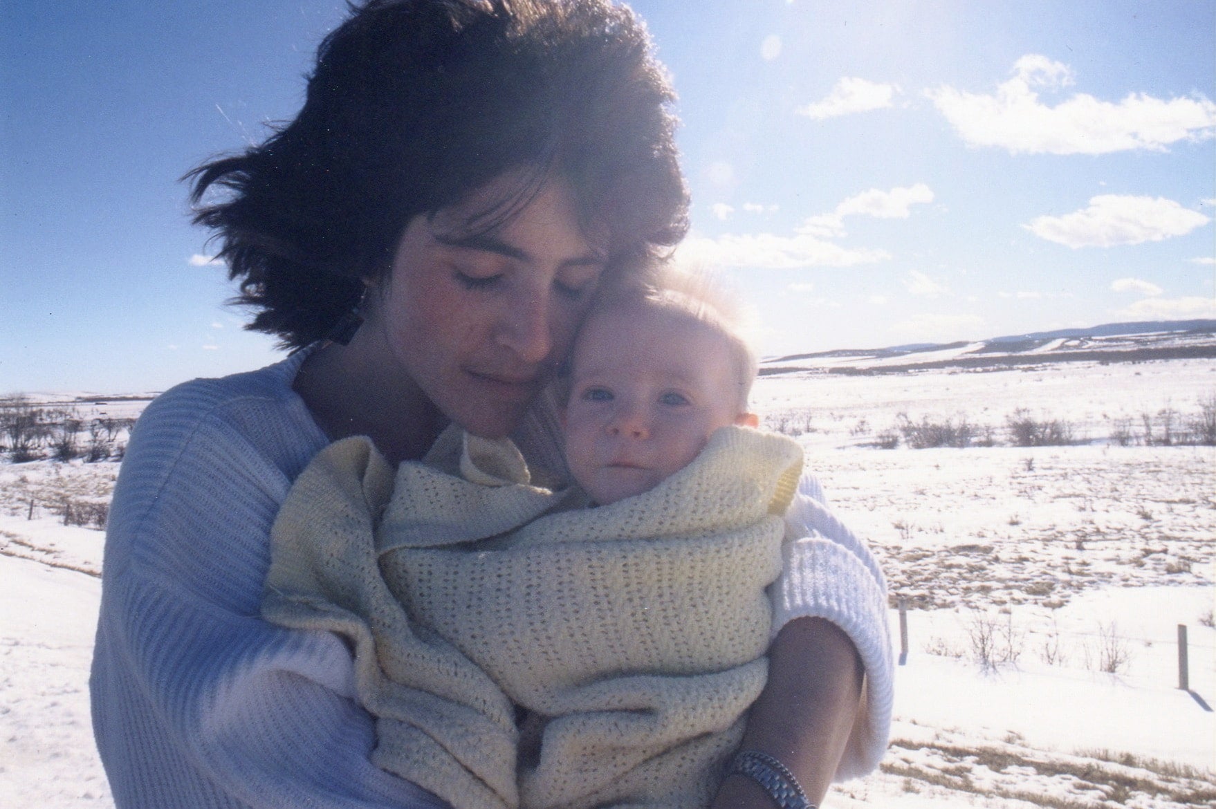image of author jan redford holding her baby outdoors