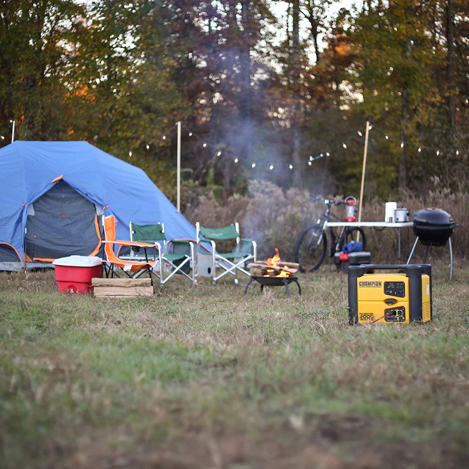  a camping generator set up at a campsite near chairs and tents plugged into lights