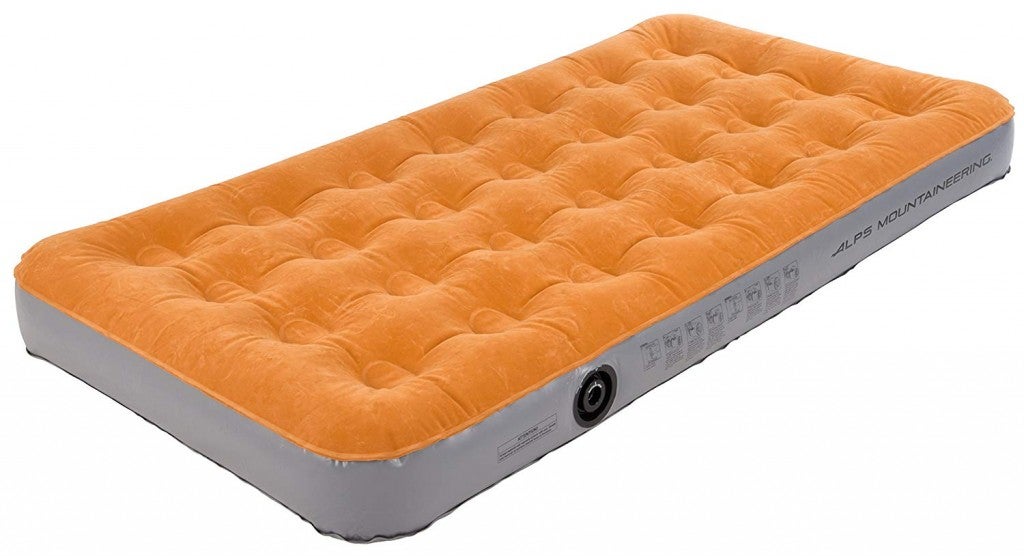 an orange camping air mattress stock photo