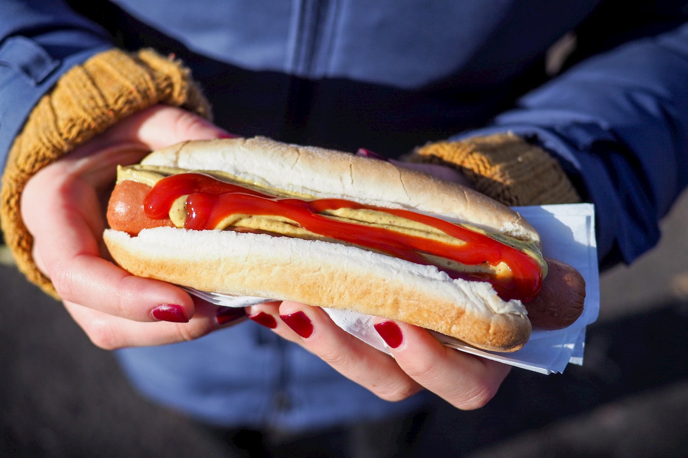 Hot dog with ketchup and mustard.