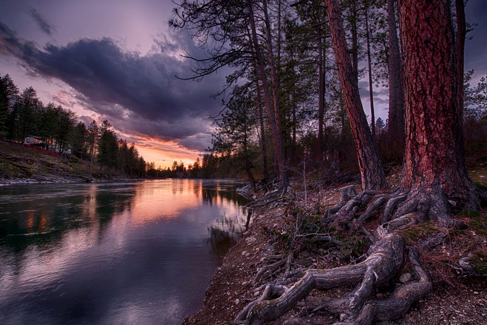 Calm waters in the Spokane River at dusk.