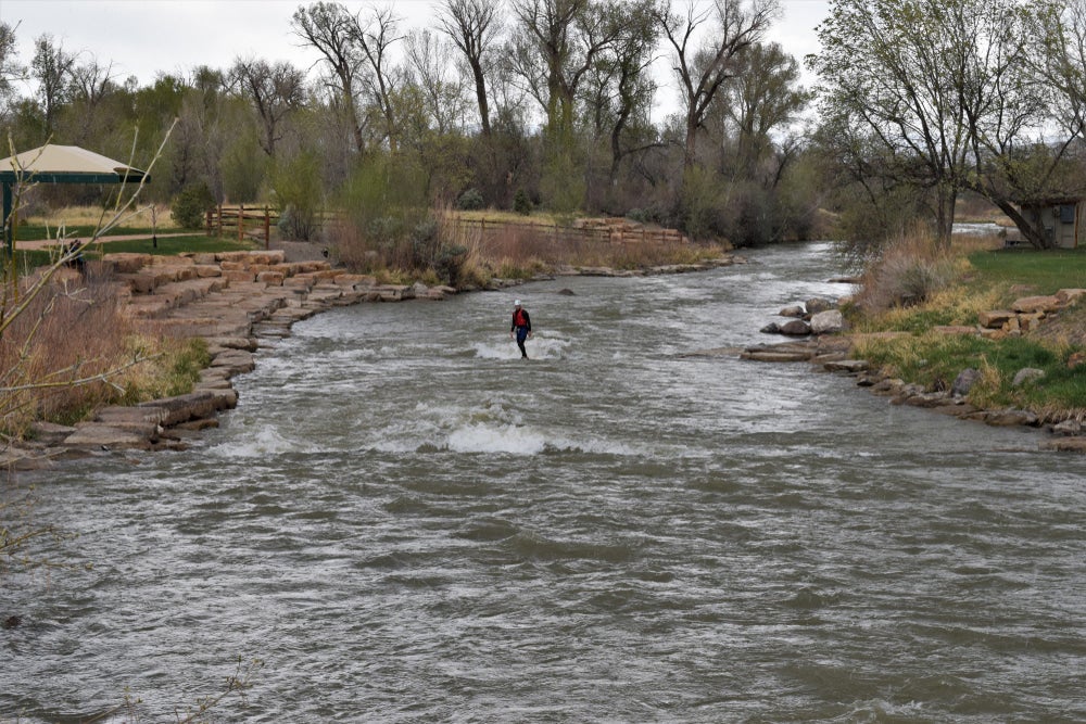 River surfer riding a small break in Colorado.