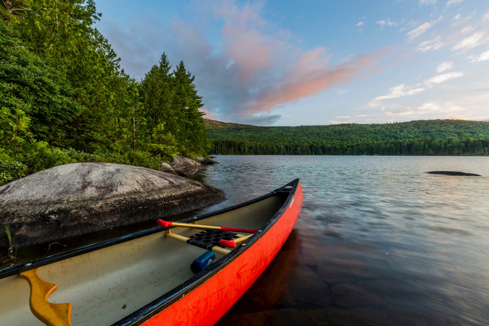 Canoe with trees and lake in background 