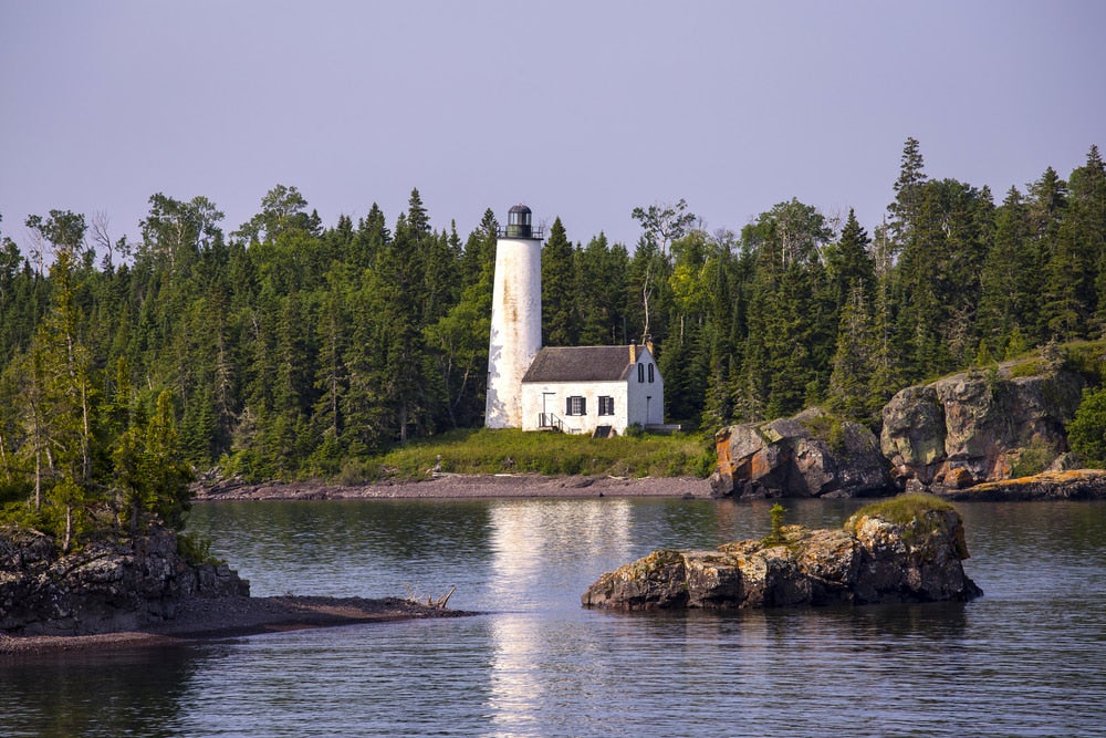 the rock harbor lighthouse on an island in lake michigan