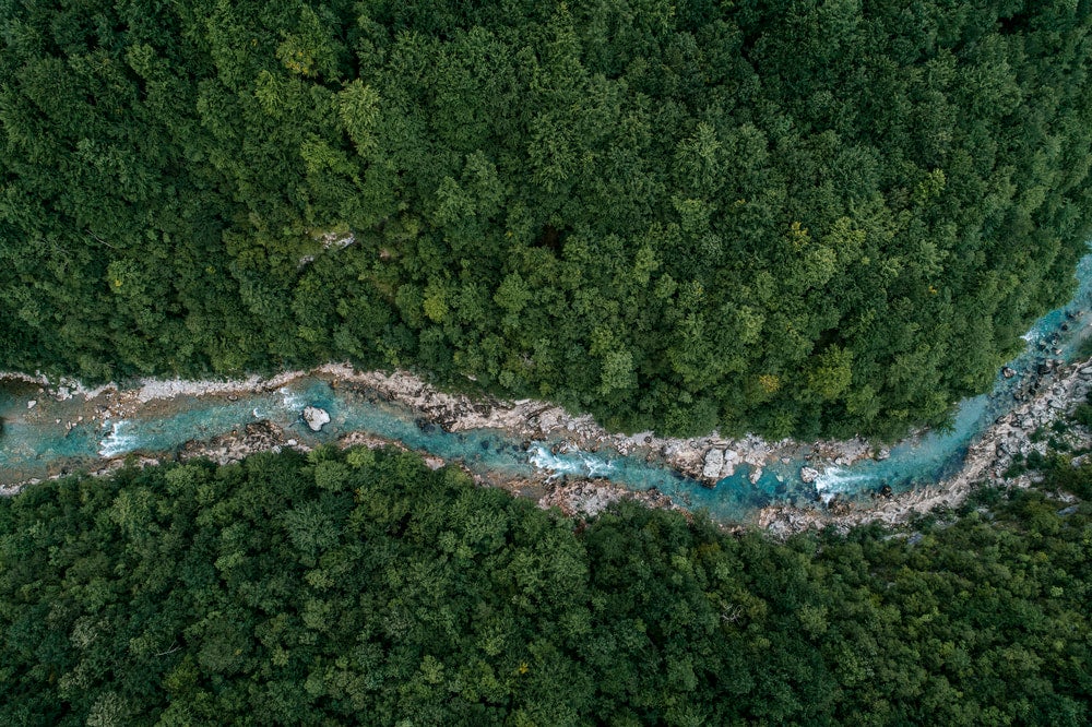 Aerial image of a river with white water.