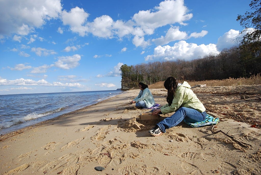 two women on the beach fossil hunting at westmoreland state park