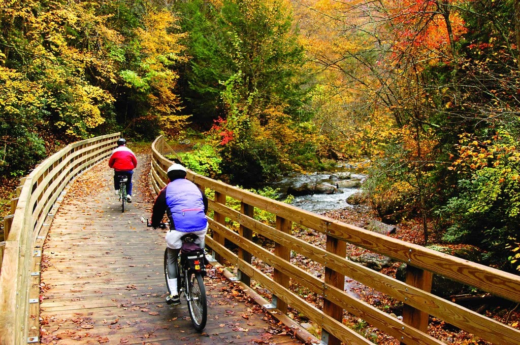 two bikers riding on the virginia creeper trail