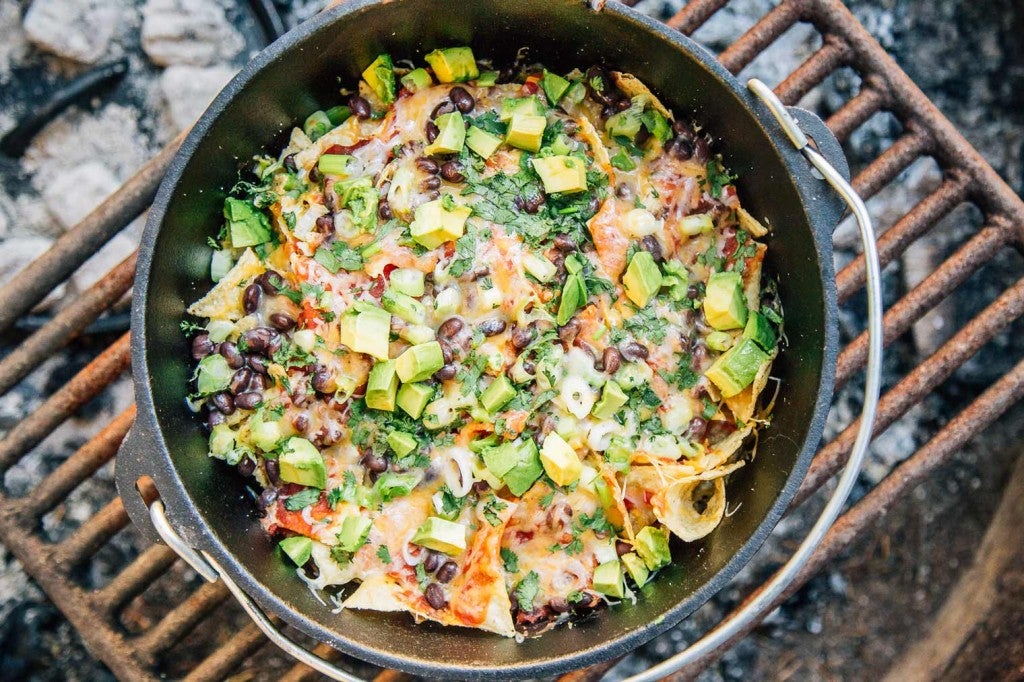 a pot of campfire nachos over the grill