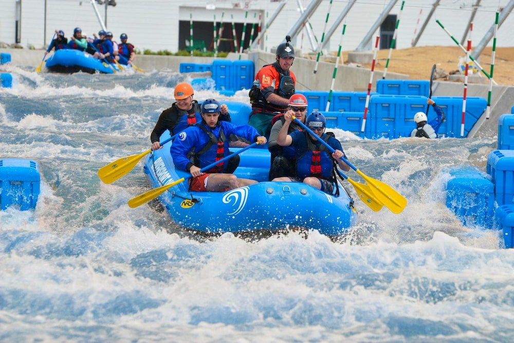 Group of five men rafting at riversport okc