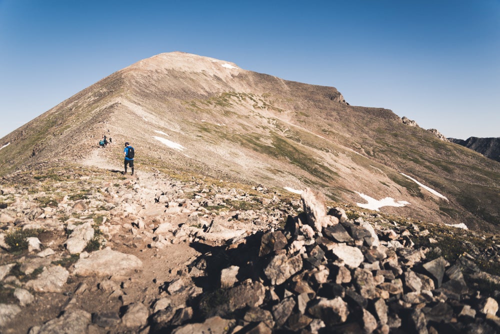 a man summiting TKTKTK