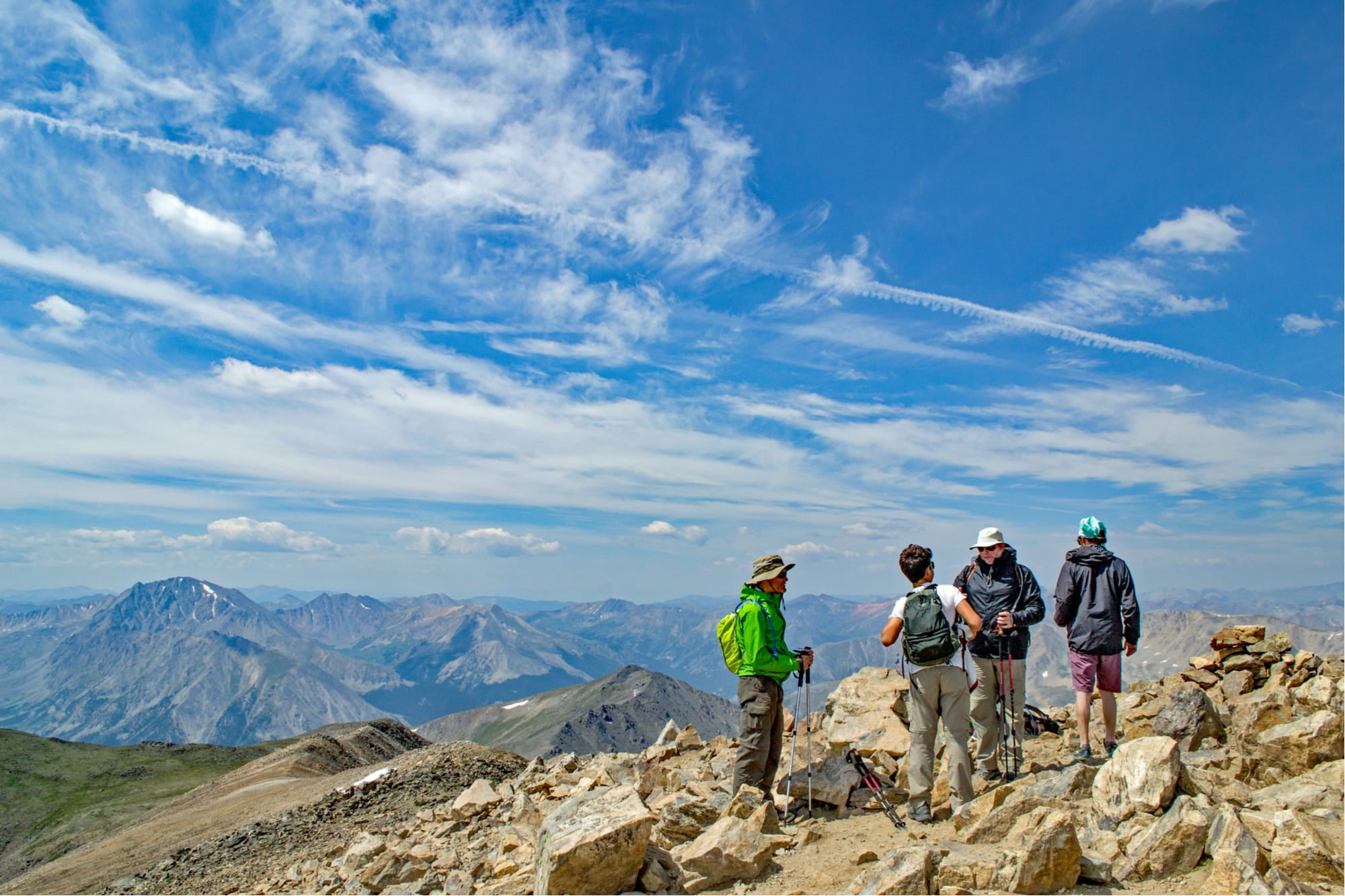 a group of hikers on the summit of mt elbert in colorado