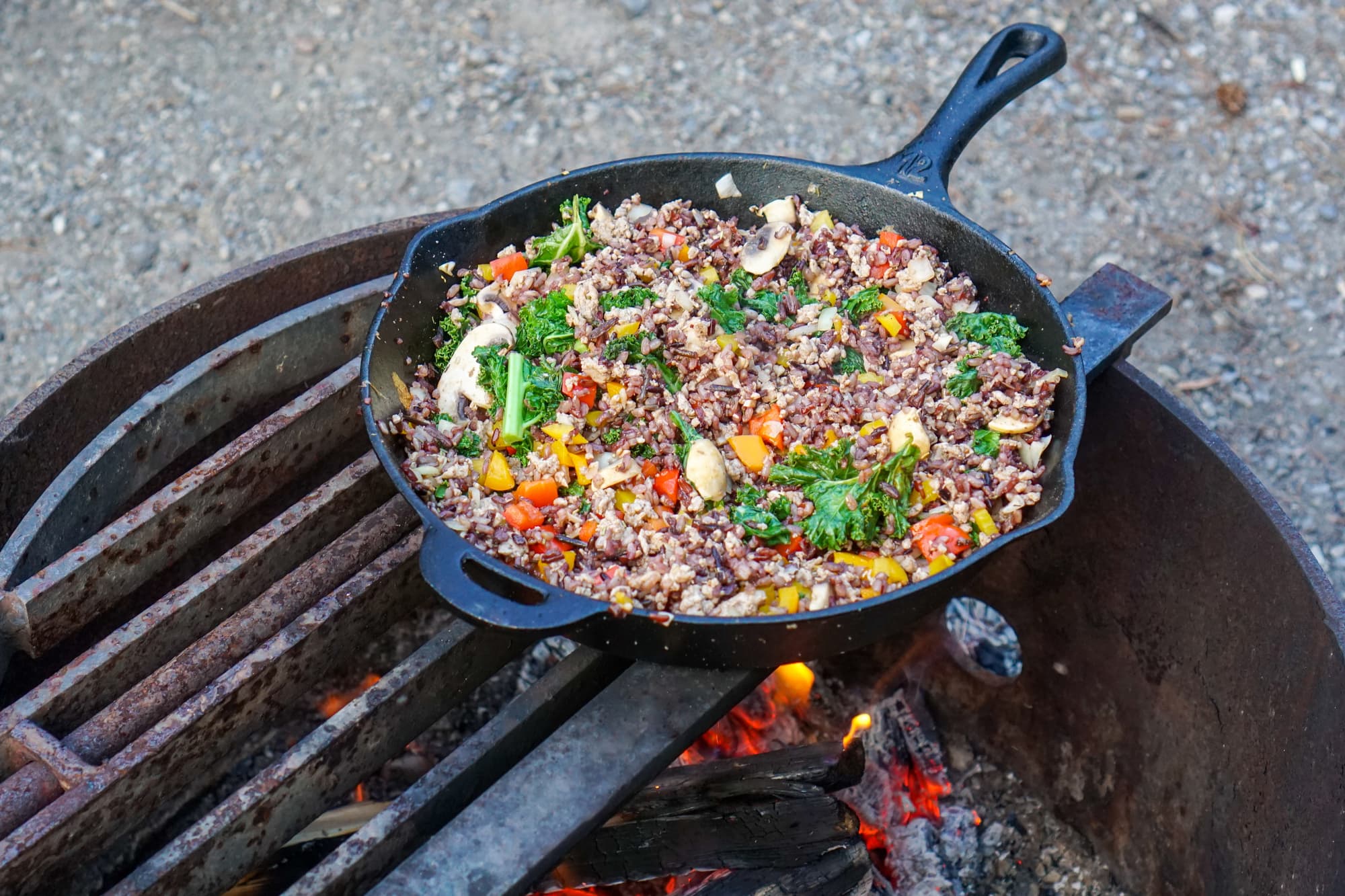 a cast iron pan full of vegetarian food