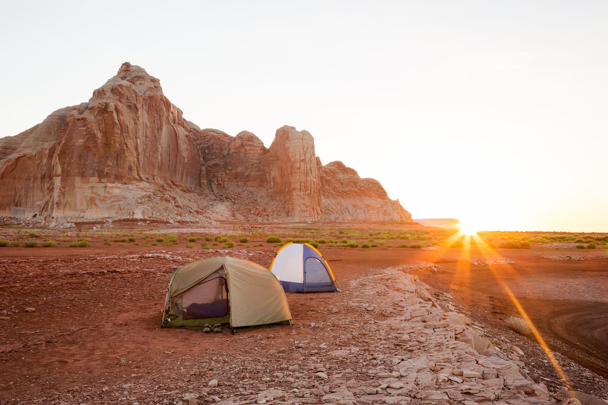 Tents in the desert of Arizona at sunset.