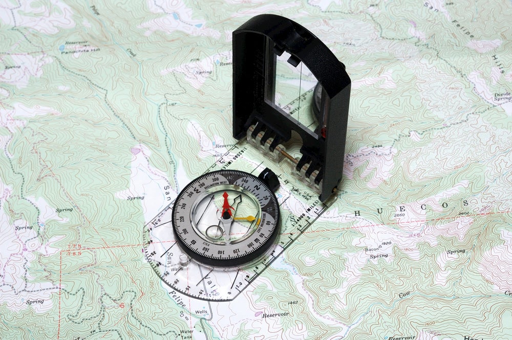 Compass on topographic map.