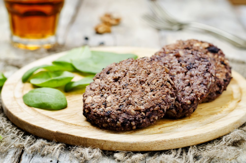 a row of black bean burgers on a table 