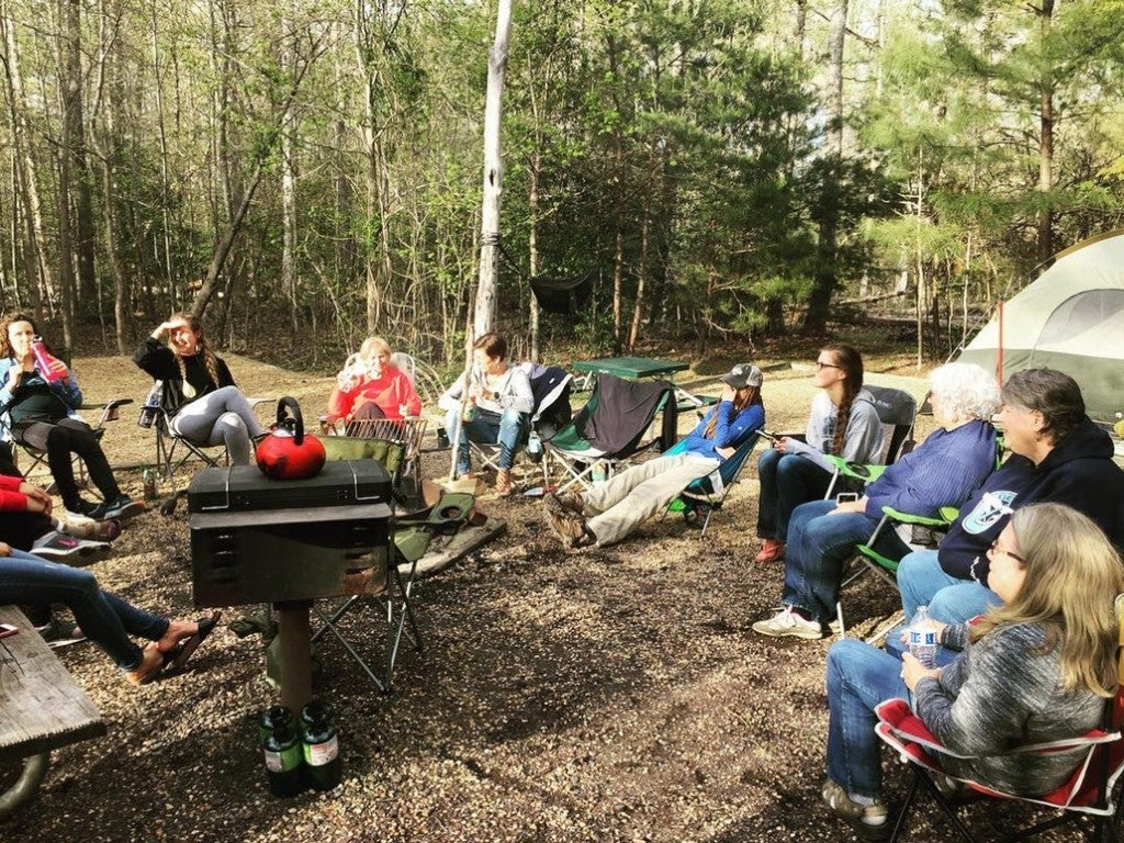 a group of campers sitting near the fire at virginia's westmoreland state park