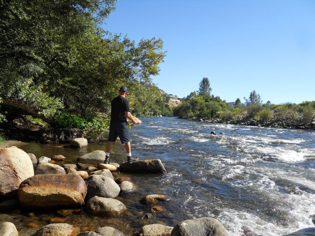 a man casting a rod into the kern river