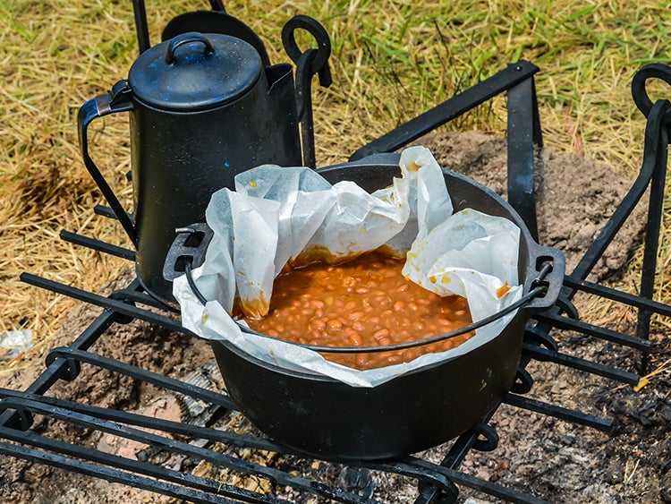 beans cooking on campfire