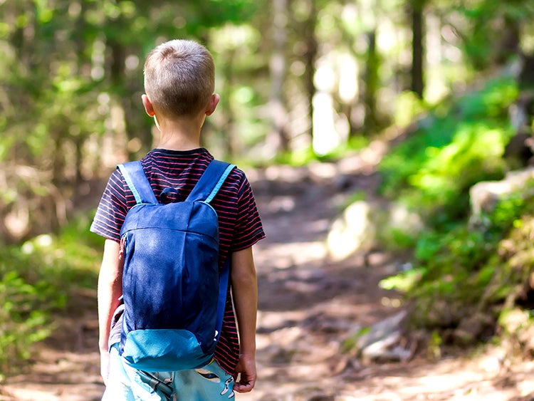 young boy on hiking trail