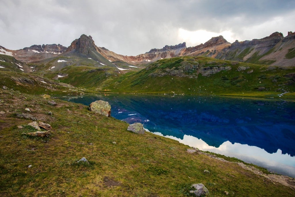 Reflection of San Juan Mountains in alpine ice lakes.