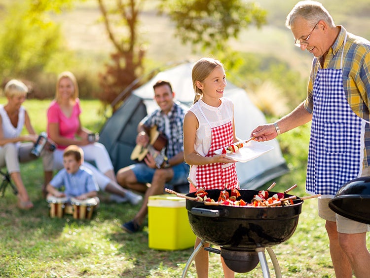 family camping with barbecue