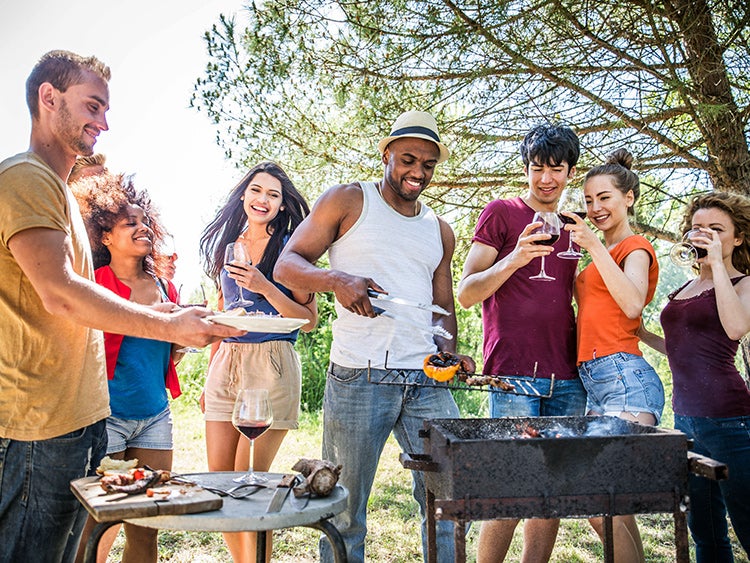 friends barbecuing with wine