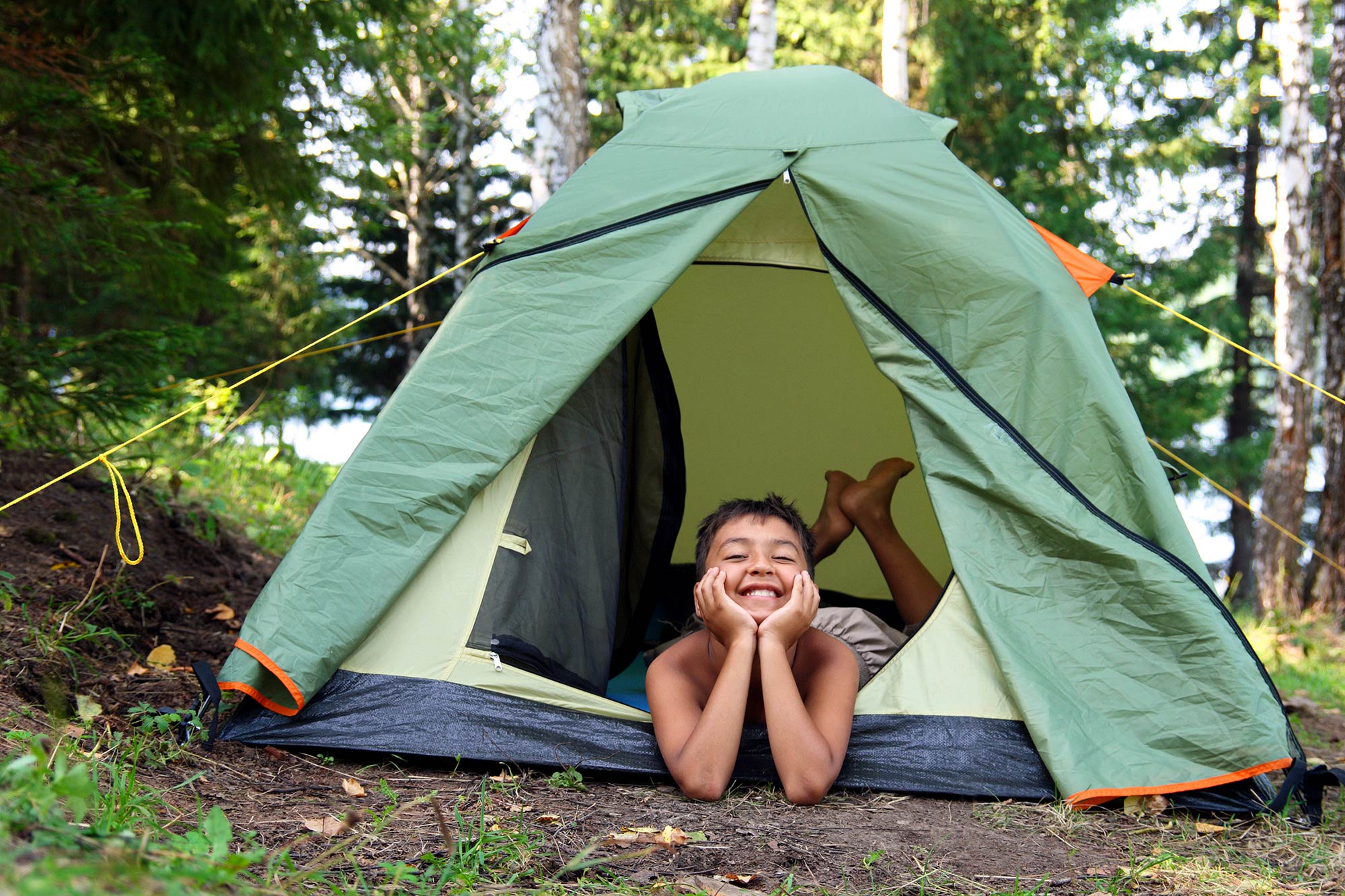happy boy in tent
