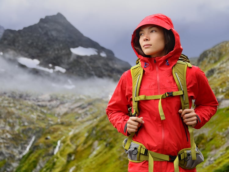 hiker on trail in rain 