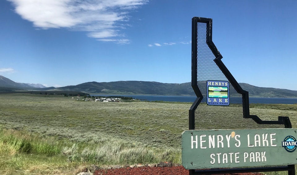 Henry's Lake State Park sign in front of wide open field in Idaho, photo from a camper on The Dyrt