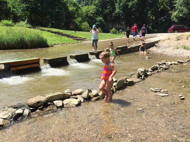 children wade in shallow water at Ledges State Park in Iowa, photo from a camper on The Dyrt