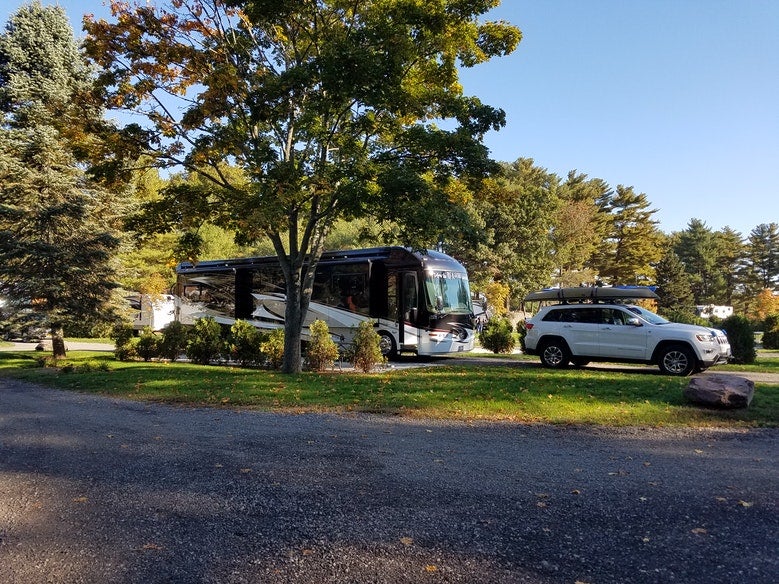 Trees surround large RV campsite at Normandy Farms in Massachusetts, photo from a camper on The Dyrt