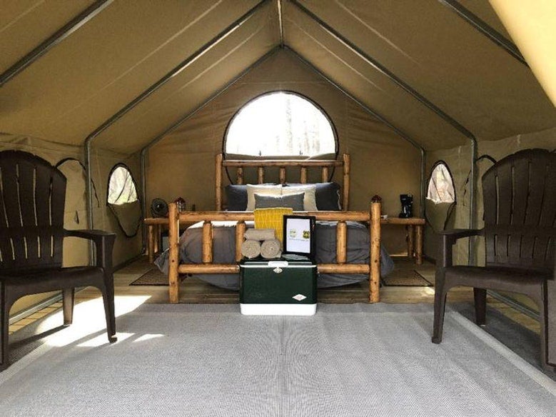 view from inside large, furnished glamping tent at Lake Powhatan, photo from a camper on The Dyrt