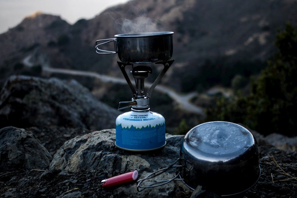 Water boiling in a backcountry camp stove.