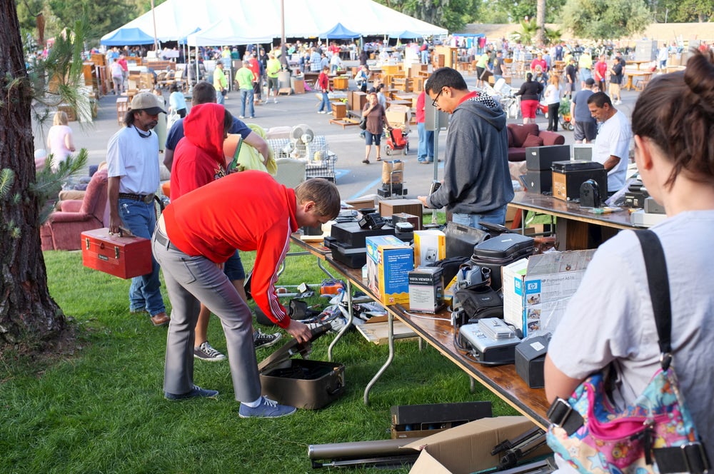 Crowded neighborhood garage sale.