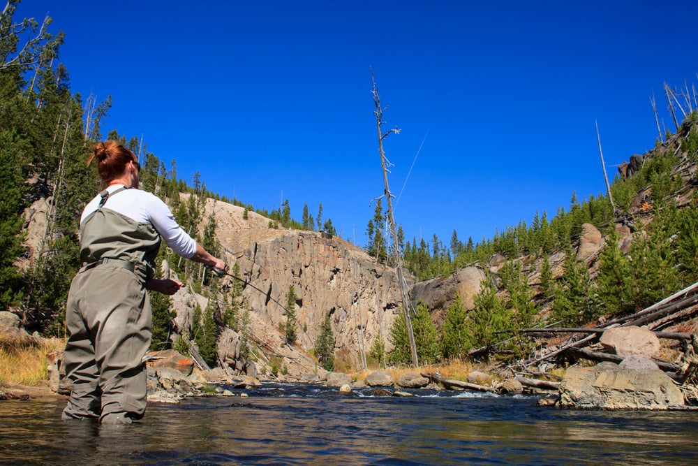 Woman fly fishing 