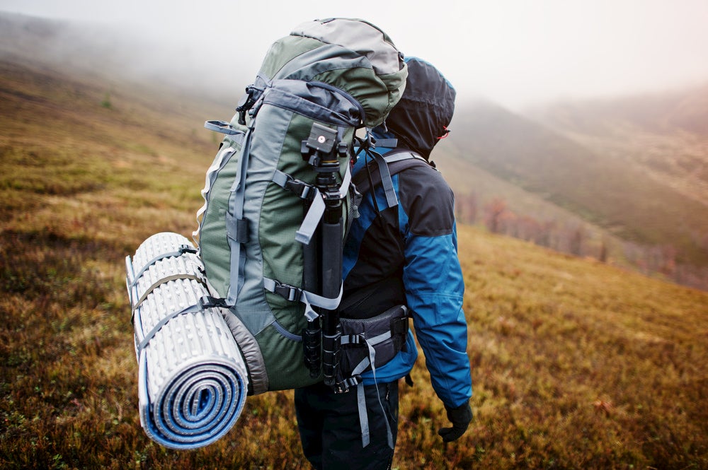 Backpacker carrying fairly large pack in the backcountry.