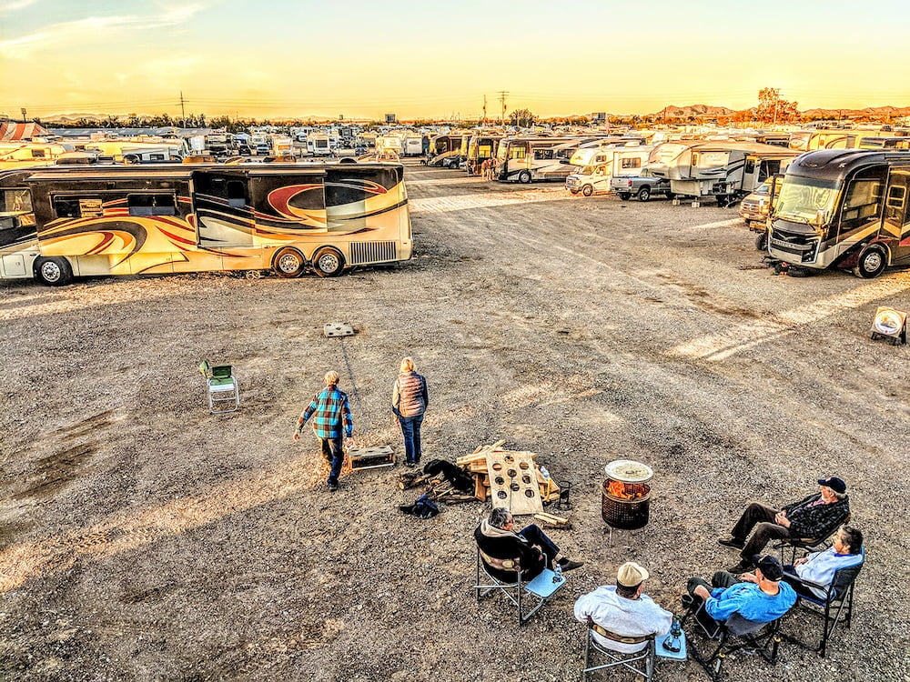a group of campers play a game in a gravel RV lot in arizona