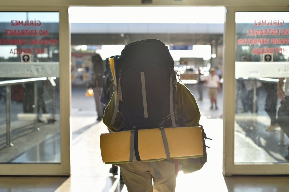 Backpacker leaving the airport.