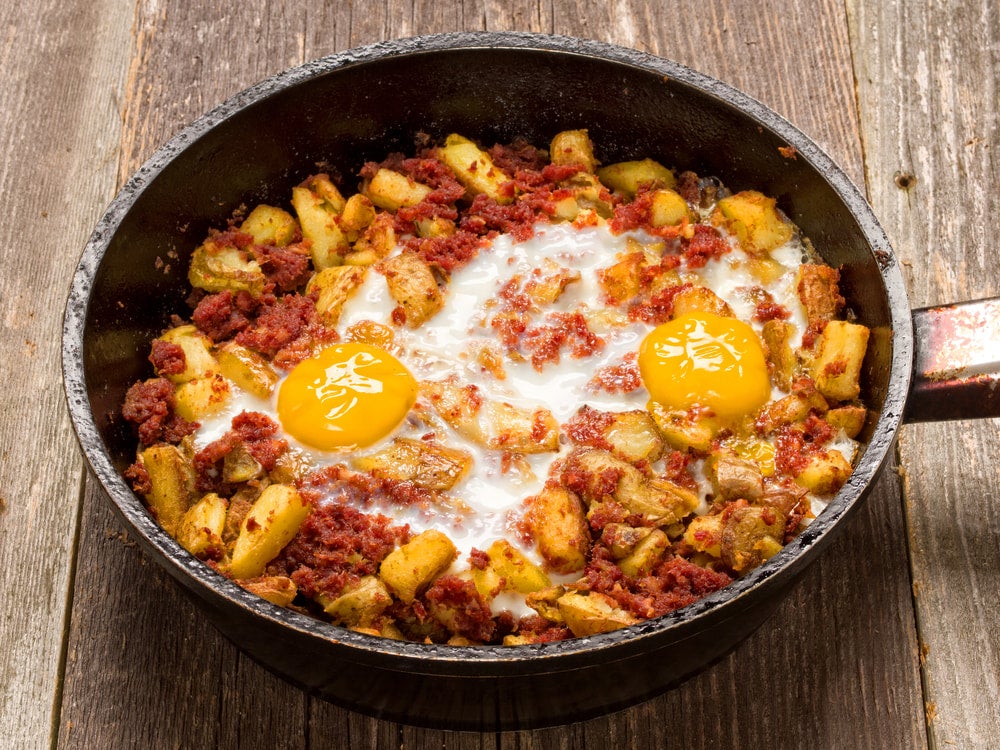 a pan of corned beef hash and eggs