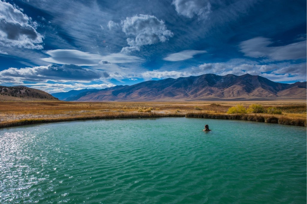 a woman swimming in a blue pool in nevada
