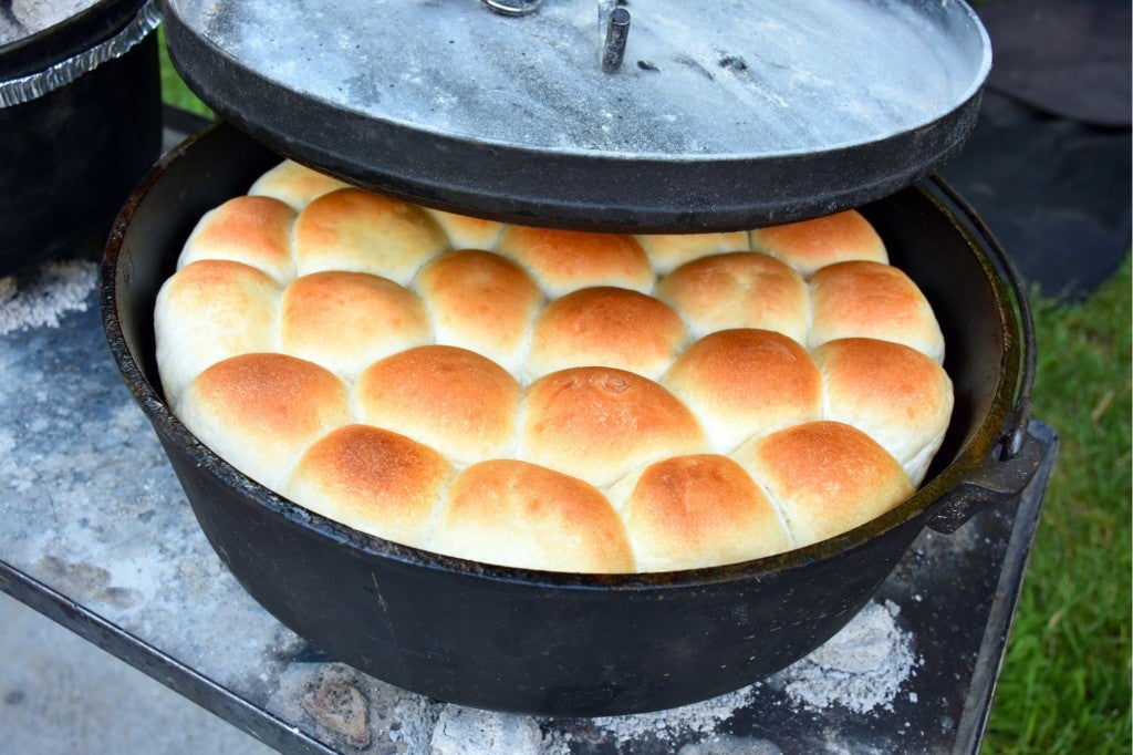 a number of bread rolls in a dutch oven