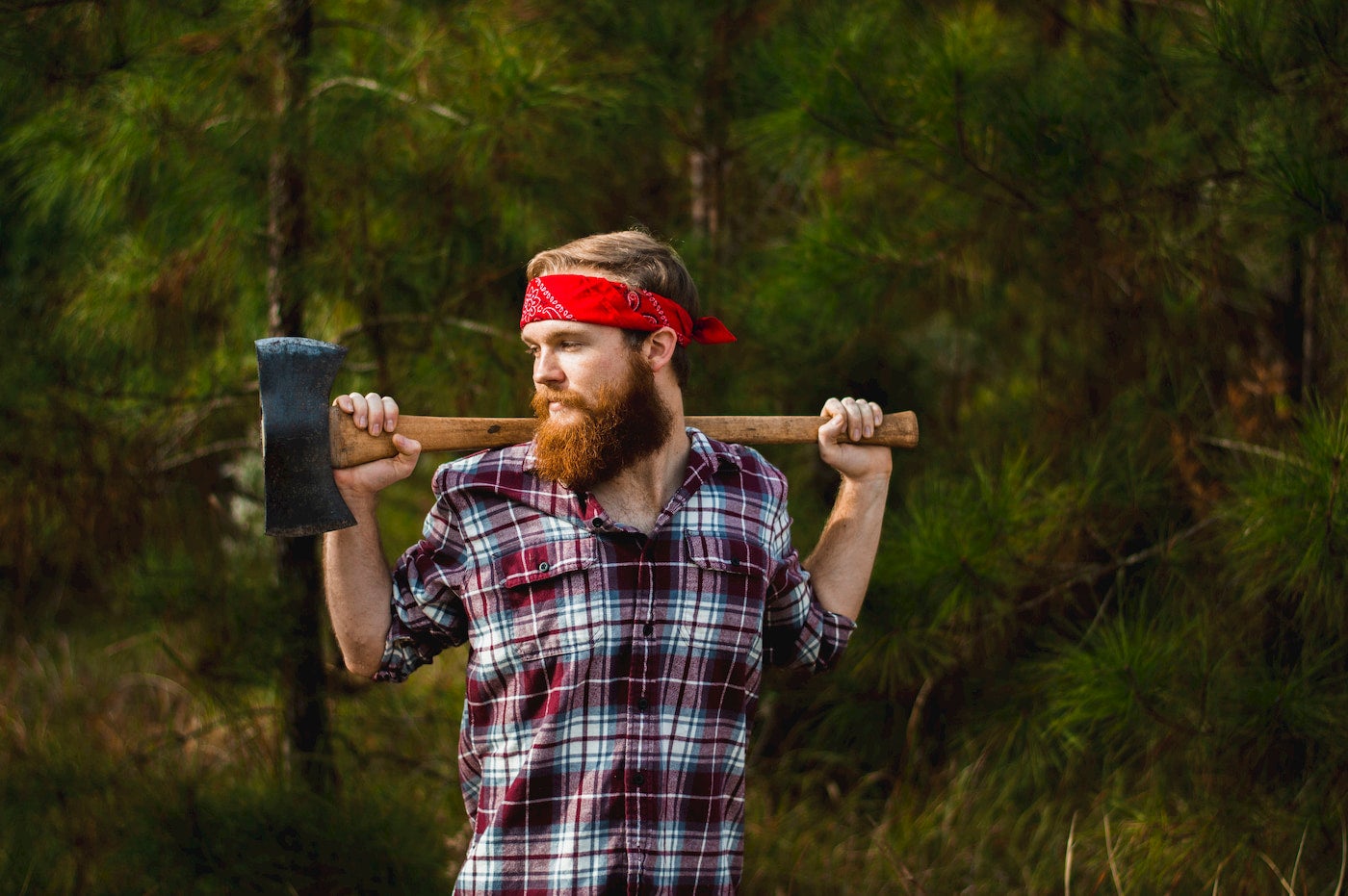 Bearded guy dressed up in a lumberjack costume,