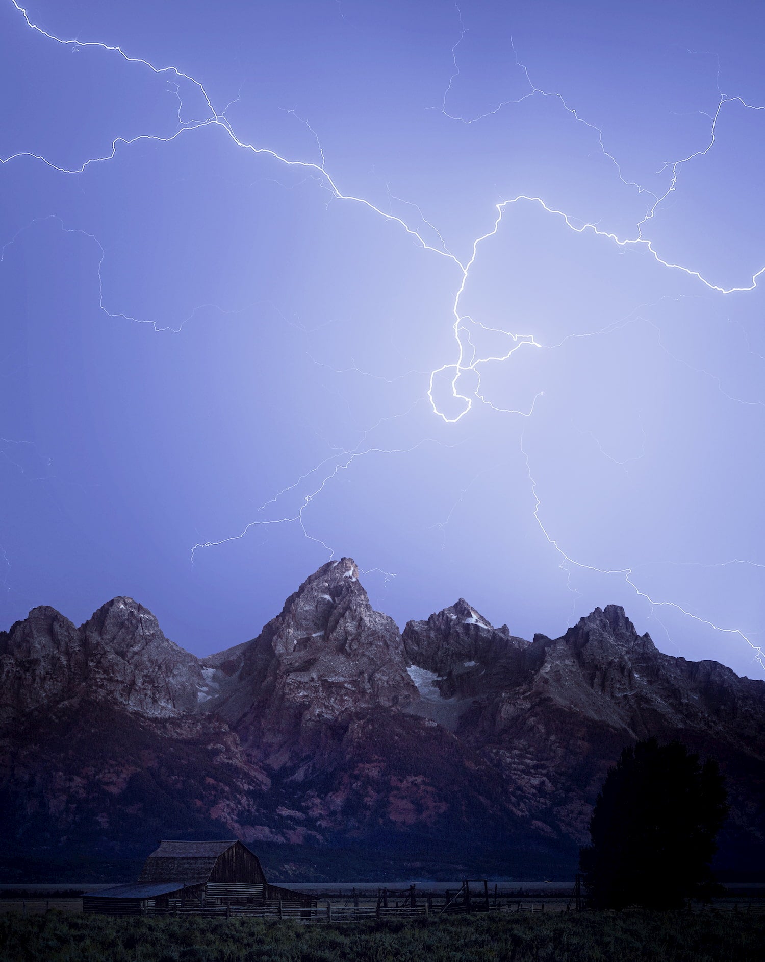 Lightning streaks over the Grand Tetons.