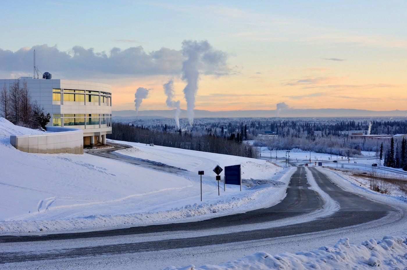 Snow covered landscape of University of Fairbanks at sunset.